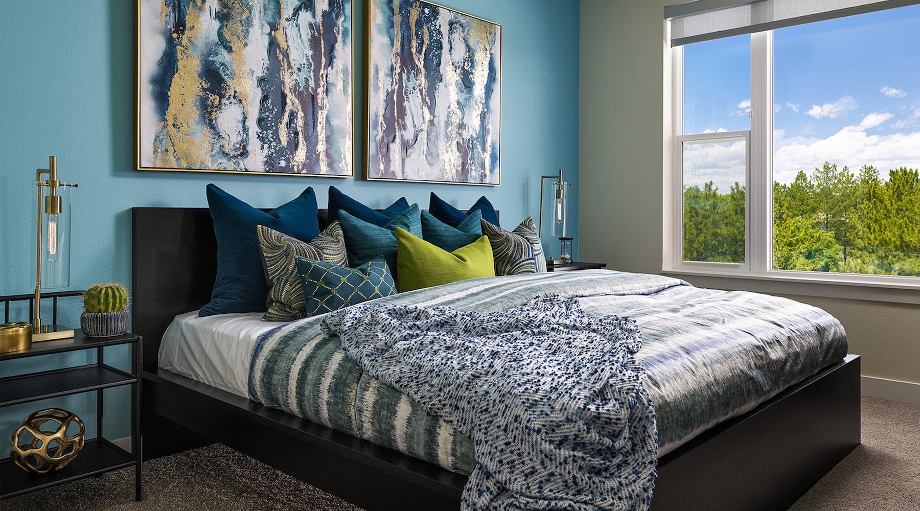 a bedroom with a bed and wall art