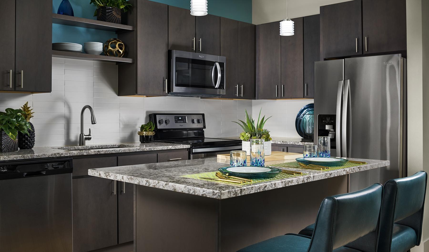 a kitchen with a dark cabinets
