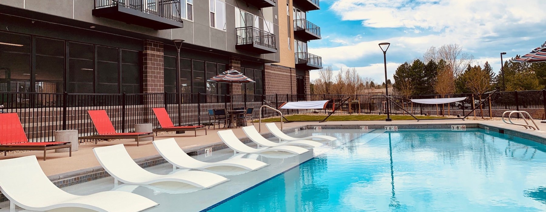 a swimming pool in front of a building