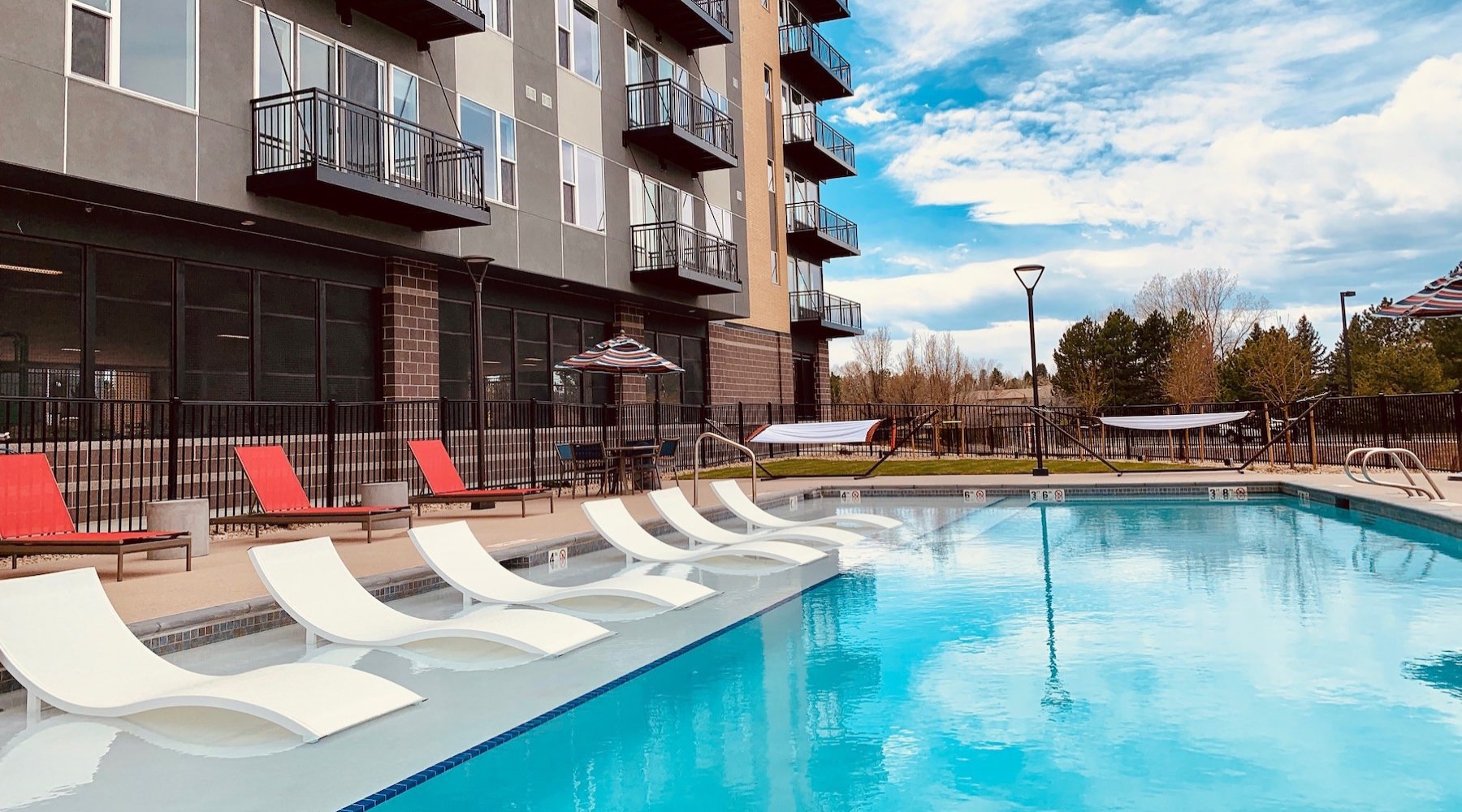 a swimming pool in front of a building